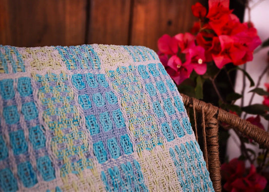 Detail of a A yellow and turquoise doubleweave table runner made with natural dyes at the Maia Organic Studio in Atitlan, Guatemala