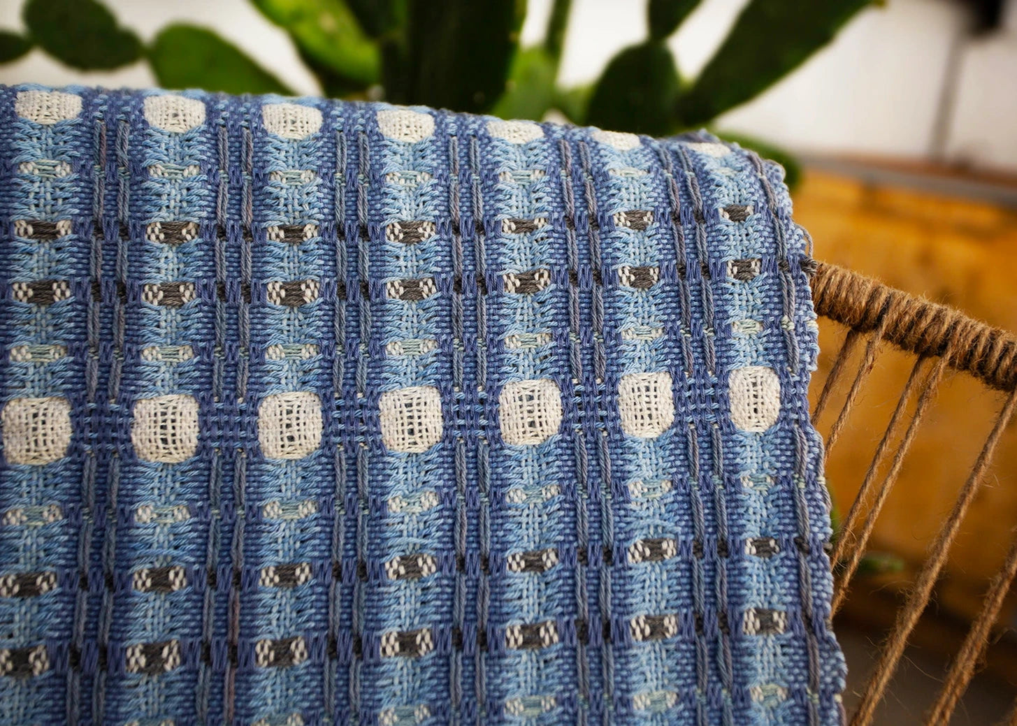 Details of a blue doubleweave table runner hand-made on a floor loom with natural dyes at Maia Organic Studio in Atitlan, Guatemala